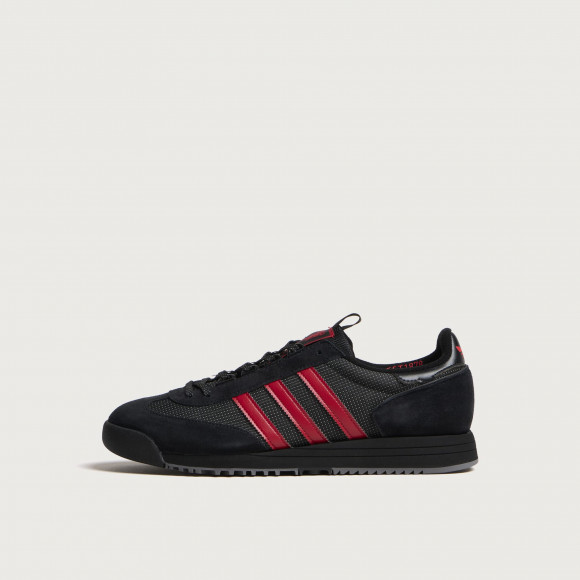 Adidas Men's Spezial Manchester United FC SL83 Sneaker in Core Black/Core Black/Silver Met. - KK0764